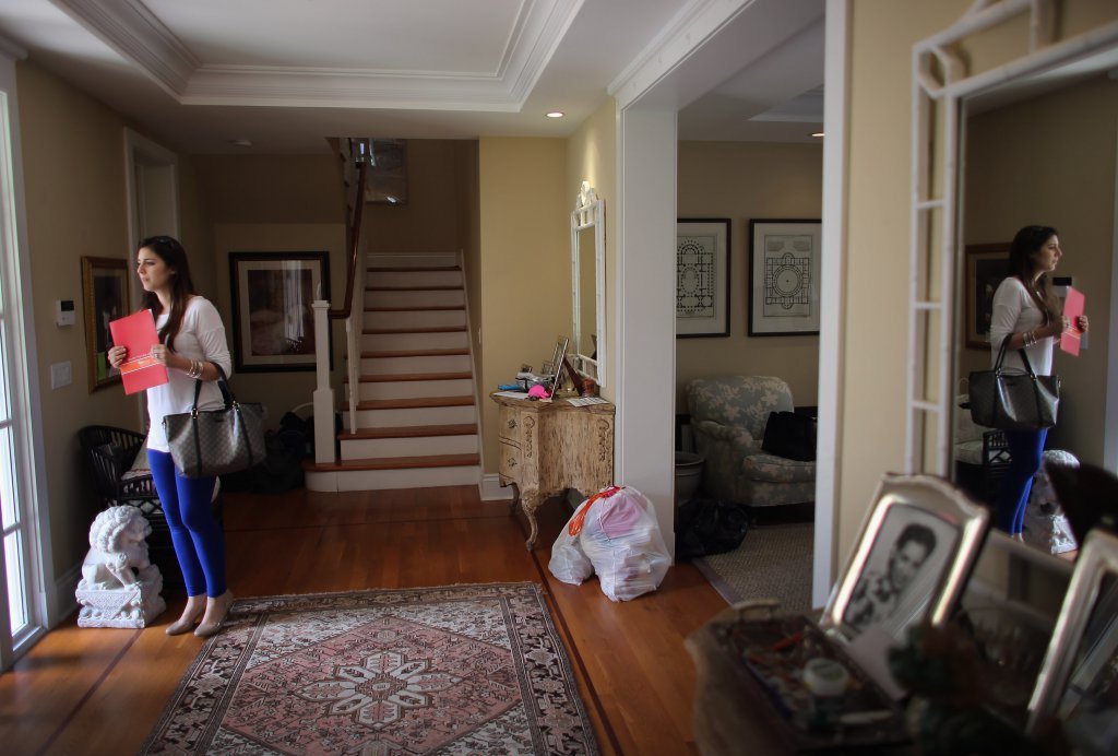 Interested buyer is touring one of the housing properties. Source: AFP
