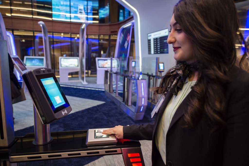 An attendant does the test of facial recognition using biometry technology in the "innovation hub" of Istanbul airport. Source: AFP